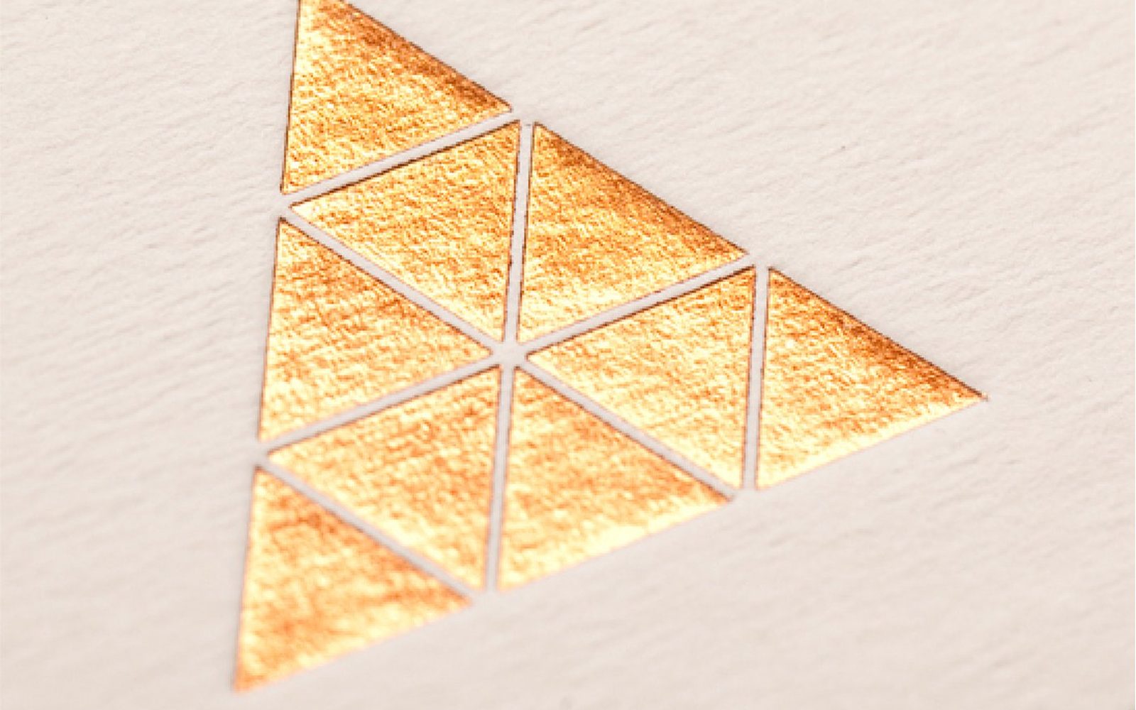LifeSpaceJourney — copper foil triangular emblem on textured paper